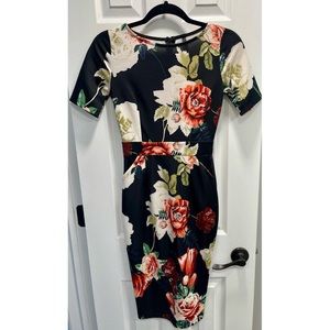 Beautiful brand new, never worn cocktail length dress.